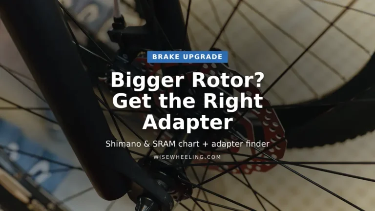 Mountain bike fork with disc brake caliper and rotor, title: Bigger Rotor? Get the Right Adapter